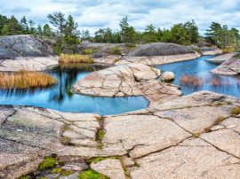 Skers of Lake Ladoga in Karelia, Russia. Tourism famous place. Landscapes of Northern Nature of Russia.